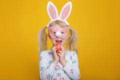 Caucasian blonde girl in white dress with pink Easter bunny ears royalty free stock image Caucasian blonde girl in white dress with pink Easter bunny ears royalty free stock image