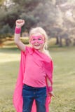 Preschool Caucasian child girl playing superhero royalty free stock images Preschool Caucasian child girl playing superhero royalty free stock images