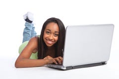 Cute African teenager girl online using laptop