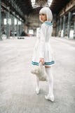 Cute anime style blonde woman with toy bear stock photo Cute anime style blonde woman with toy bear stock photo