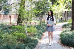 Cute Asian Chinese Pretty Girl Wear Student Suit In School Hold A Book Walking Royalty Free Stock Photo Cute Asian Chinese Pretty Girl Wear Student Suit In School Hold A Book Walking Royalty Free Stock Photo