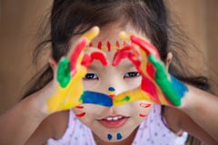 Cute asian little child girl with painted hands make heart shape Stock Image Cute asian little child girl with painted hands make heart shape Stock Image