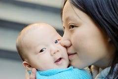 Cute Baby Boy And Mother Stock Image