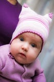 Cute baby girl wearing violet clothes