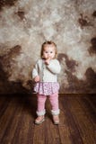 Cute blond little girl with big grey eyes and plump cheeks stock photo Cute blond little girl with big grey eyes and plump cheeks stock photo