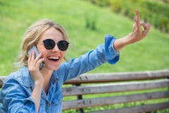 Cute blonde talking on a cell phone stock image Cute blonde talking on a cell phone stock image