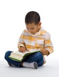 Cute Boy Reading A Book Royalty Free Stock Photos
