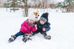 Cute children and dog playing in snow. royalty free stock image Cute children and dog playing in snow. royalty free stock image
