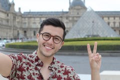 Cute ethnic man taking a selfie outdoors stock photography Cute ethnic man taking a selfie outdoors stock photography