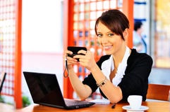 Cute Female At The Cafe Using Cellphone And Laptop Stock Photo Cute Female At The Cafe Using Cellphone And Laptop Stock Photo