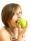 Cute Girl Biting A Green Apple Stock Photo