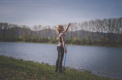 Cute Girl Holding A Fishing Rod Royalty Free Stock Photography