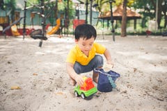 Cute little asian boy in a park on a nice day outdoors royalty free stock photos Cute little asian boy in a park on a nice day outdoors royalty free stock photos