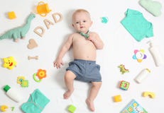 Cute little baby with clothing and accessories on white background stock photos Cute little baby with clothing and accessories on white background stock photos
