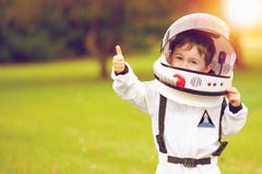 Cute little boy playing astronaut