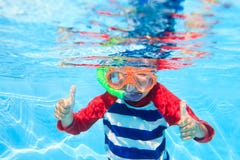 Cute little boy swimming underwater royalty free stock photo Cute little boy swimming underwater royalty free stock photo