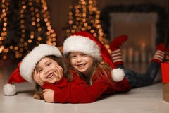 Cute Little Children Wearing Santa Hats. Christmas Time Royalty Free Stock Photography Cute Little Children Wearing Santa Hats. Christmas Time Royalty Free Stock Photography