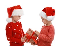 Cute Little Children Wearing Santa Hats With Christmas Gift Royalty Free Stock Images