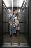 Cute little daughter and her young parents royalty free stock photography Cute little daughter and her young parents royalty free stock photography