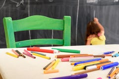Cute little girl drawing and painting at kindergarten. Creative activities kids club stock photography Cute little girl drawing and painting at kindergarten. Creative activities kids club stock photography