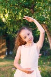 Cute little girl dreams of becoming a ballerina. Child girl in w royalty free stock image Cute little girl dreams of becoming a ballerina. Child girl in w royalty free stock image