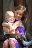 Cute Little Girl Holds A Baby Boy And Smiles Stock Image Cute Little Girl Holds A Baby Boy And Smiles Stock Image