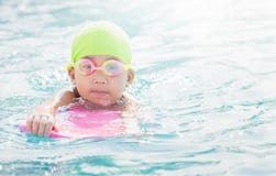 Cute little girl learning how to swim. stock image Cute little girl learning how to swim. stock image