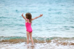 Cute little girl playing on a beach stock photography Cute little girl playing on a beach stock photography