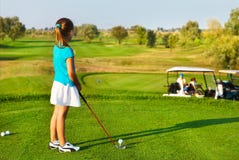 Cute Little Girl Playing Golf On A Field Outdoor Royalty Free Stock Photo
