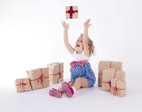Cute little girl sitting on the floor surrounded royalty free stock images Cute little girl sitting on the floor surrounded royalty free stock images