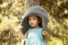 Cute Little Girl Smiling In A Park Royalty Free Stock Photo