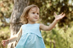 Cute Little Girl Smiling In A Park Royalty Free Stock Photos
