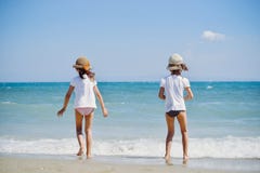 Cute little girls on the beach stock images Cute little girls on the beach stock images