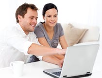Cute man showing something on the laptop screen royalty free stock photography Cute man showing something on the laptop screen royalty free stock photography