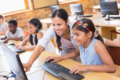 Cute pupils in computer class with teacher stock photo Cute pupils in computer class with teacher stock photo