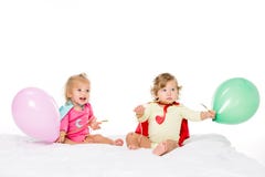 cute toddlers in superhero capes with balloons stock photos cute toddlers in superhero capes with balloons stock photos