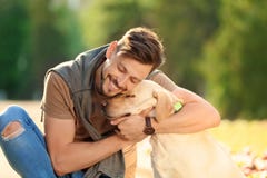 Cute yellow labrador retriever with owner stock photo Cute yellow labrador retriever with owner stock photo