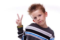 Cute Young Boy Holding Up The Peace Sign Stock Photo