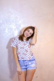 Pretty woman with smile posing on camera, standing on background royalty free stock photo Pretty woman with smile posing on camera, standing on background royalty free stock photo