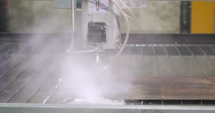 Water-abrasive CNC machine for cutting metal on water table