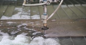 Water-abrasive CNC machine for cutting metal on water table