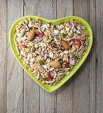 Cuvette de Muesli de granola de fruit de céréale de coeur images stock Cuvette de Muesli de granola de fruit de céréale de coeur images stock