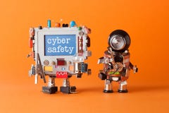 Cyber safety concept. System administrator robot and creative computer character with text message on blue desktop. Orange backgro royalty free stock images Cyber safety concept. System administrator robot and creative computer character with text message on blue desktop. Orange backgro royalty free stock images