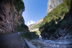 Cycling mountain road. Misty mountain road in high mountains.. Cloudy sky with mountain road. Summertime stock photo Cycling mountain road. Misty mountain road in high mountains.. Cloudy sky with mountain road. Summertime stock photo