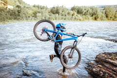 Cyclist with bicycle on the mountains royalty free stock photos Cyclist with bicycle on the mountains royalty free stock photos
