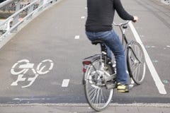 Cyclists On Bike Lane In Amsterdam, Holland Royalty Free Stock Photo Cyclists On Bike Lane In Amsterdam, Holland Royalty Free Stock Photo