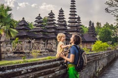Dad and son tourists in Traditional balinese hindu Temple Taman stock images Dad and son tourists in Traditional balinese hindu Temple Taman stock images