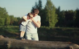 Dad and son walking, father helps child to make baby steps stock photo Dad and son walking, father helps child to make baby steps stock photo