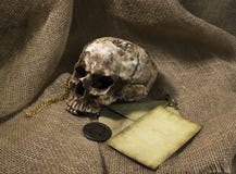 Damaged skull with a letter, with a burlap background stock photo Damaged skull with a letter, with a burlap background stock photo