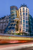 The Dancing House or Fred and Ginger building in Prague. Long exposure night scene of building with car light trail